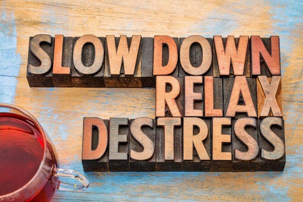 slow down, relax, destress word abstract in wood type